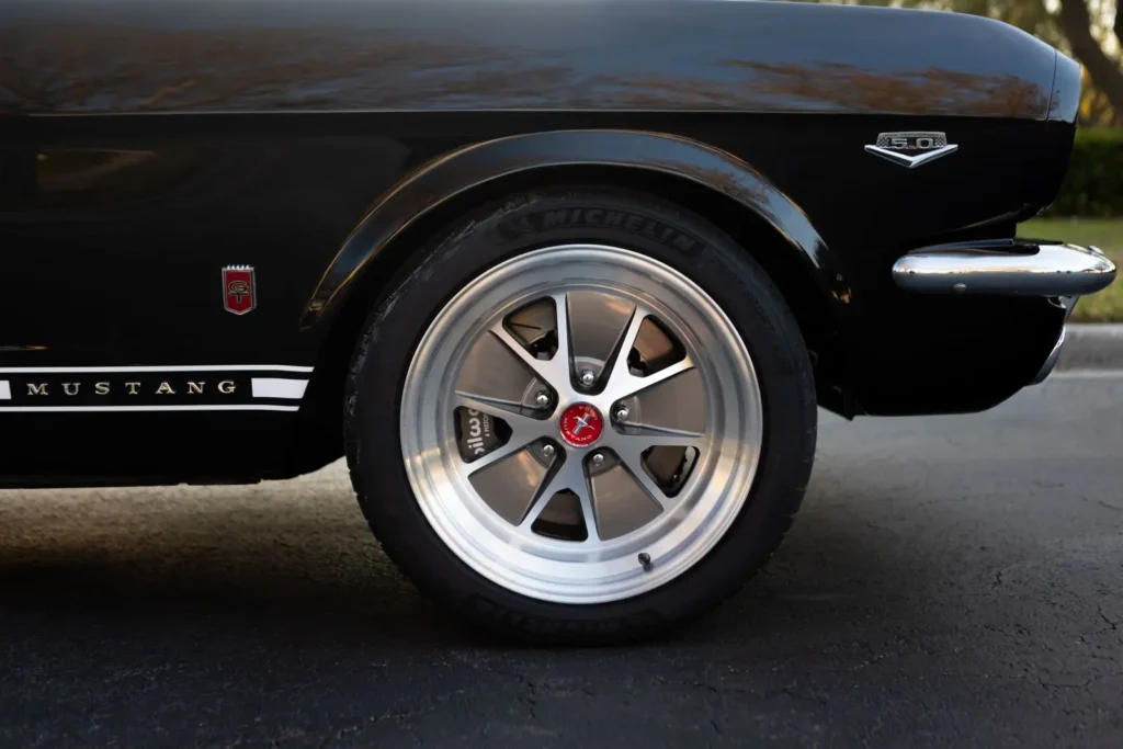 A close up wheel rim shot of a 1966 Mustang 2+2 Fastback logo