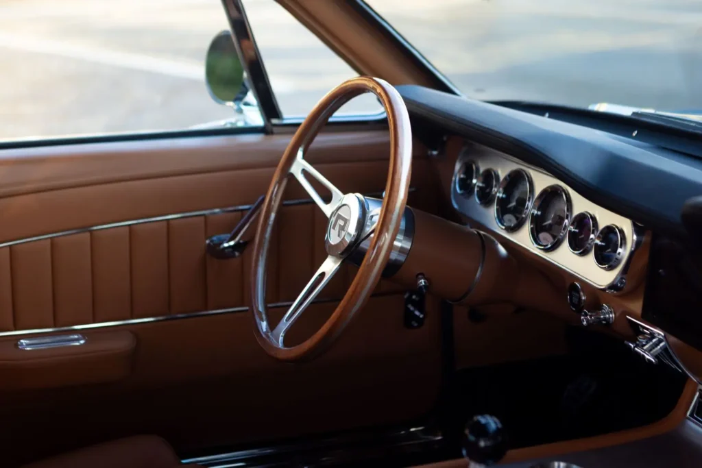 Close-up of a 1966 Mustang 2+2 Fastback steering wheel and dashboard