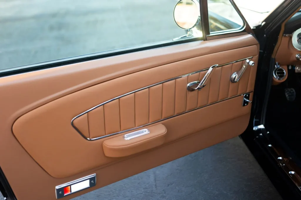 A close-up look of a 1966 Mustang 2+2 Fastback door design leather