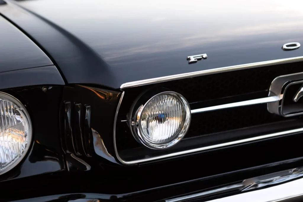 A close up front right light of a 1966 Mustang 2+2 Fastback logo