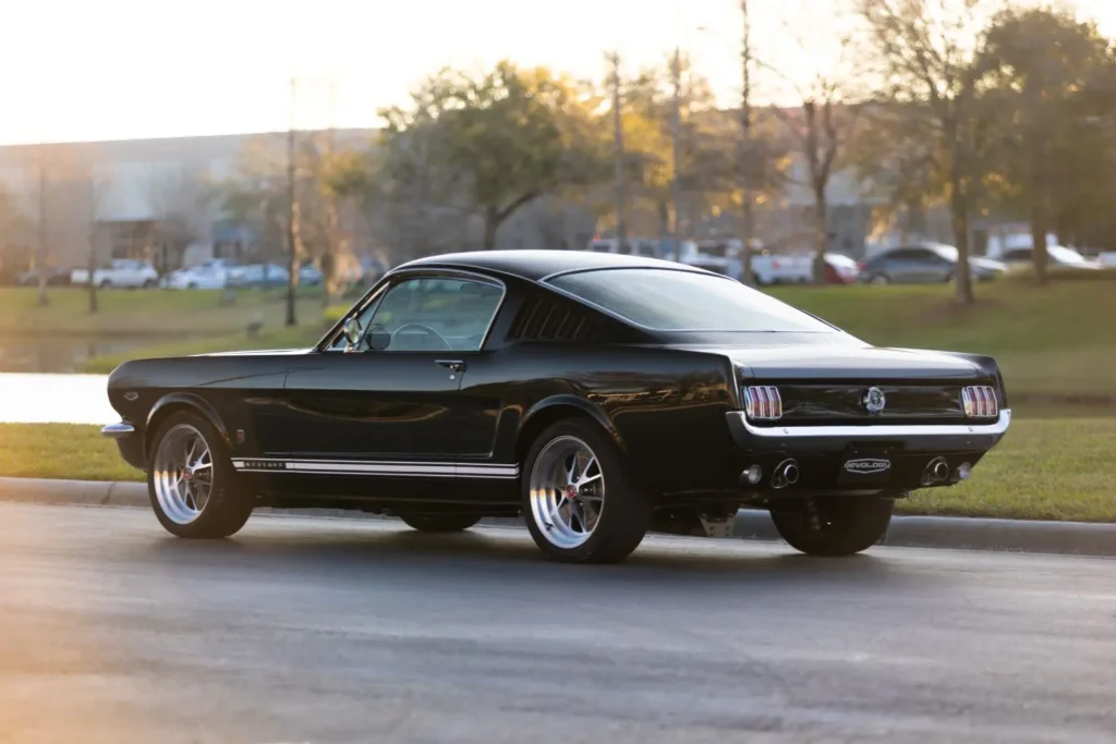 A back view of a 1966 Mustang 2+2 Fastback parked