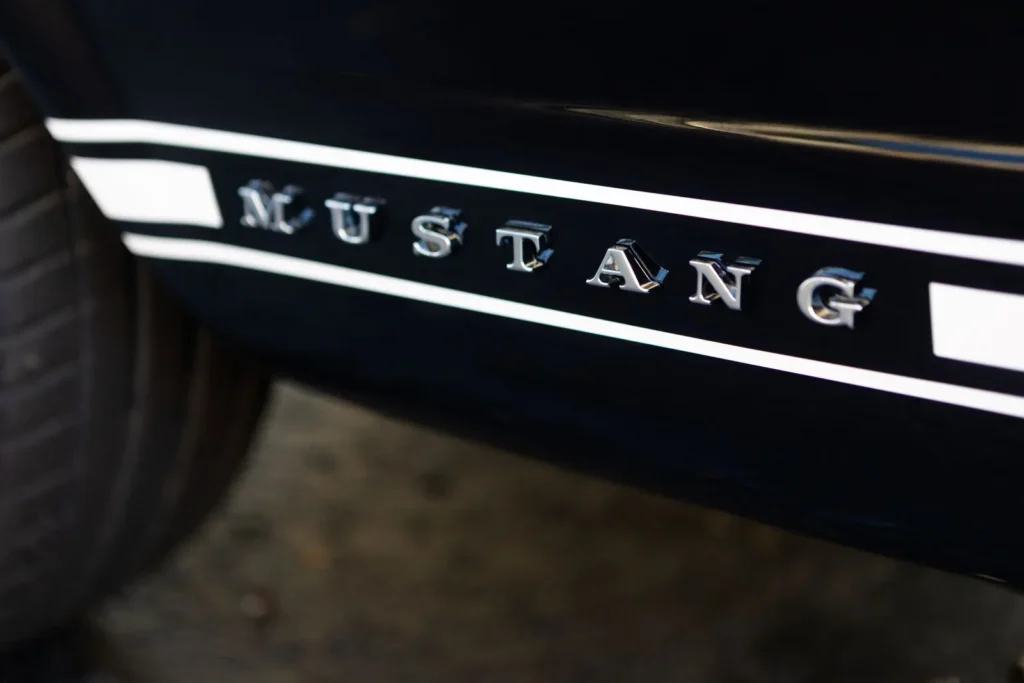 A close-up look of a 1966 Mustang 2+2 Fastback letter emblem