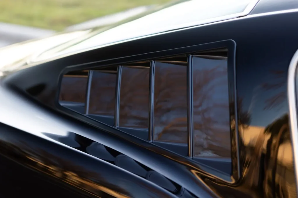 A close-up of a 1966 Mustang 2+2 Fastback side Fender vents