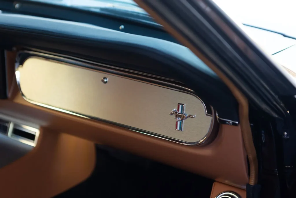 Closer look of a 1966 Mustang 2+2 Fastback emblem glove compartment