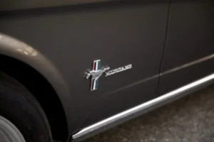 A close-up look of a 1966 Mustang 2+2 Fastback letter emblem