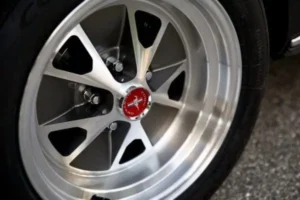 A close-up of a 1966 Mustang 2+2 Fastback wheel
