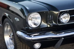 The front headlight of a 1966 Mustang 2+2 Fastback