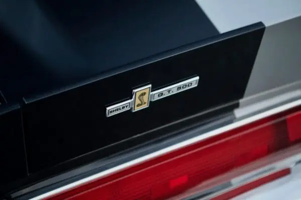 A close-up of a 1967 Shelby GT 500 back emblem
