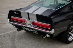 A close-up of a Black 1967 Shelby GT 500 trunk
