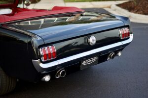 A close-up of a black 1966 Mustang Convertible trunk.