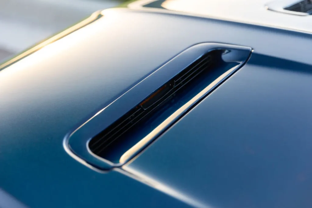 1968 Mustang GT 2+2 Fastback hood fender vents close up shot.