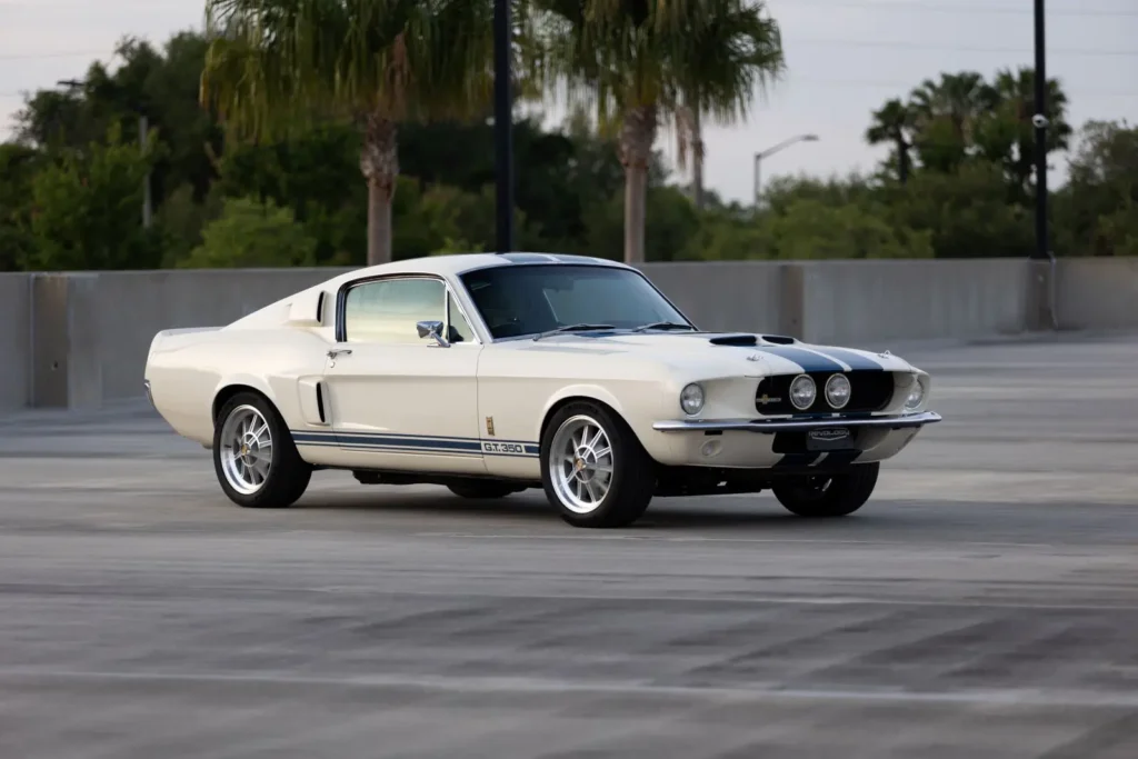 A sidecar line of a white 1967 Shelby GT 350.