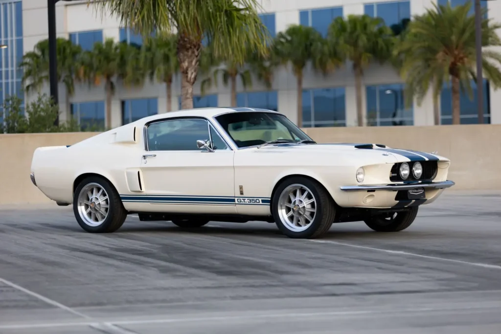 A lateral view of a white 1967 Shelby GT 350.