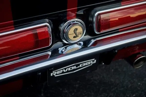 A close-up of a 1967 Shelby GT 350 trunk emblem