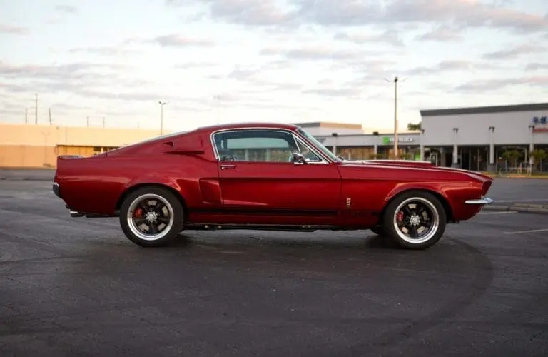 A sidecar line of a red 1967 Shelby GT 350.