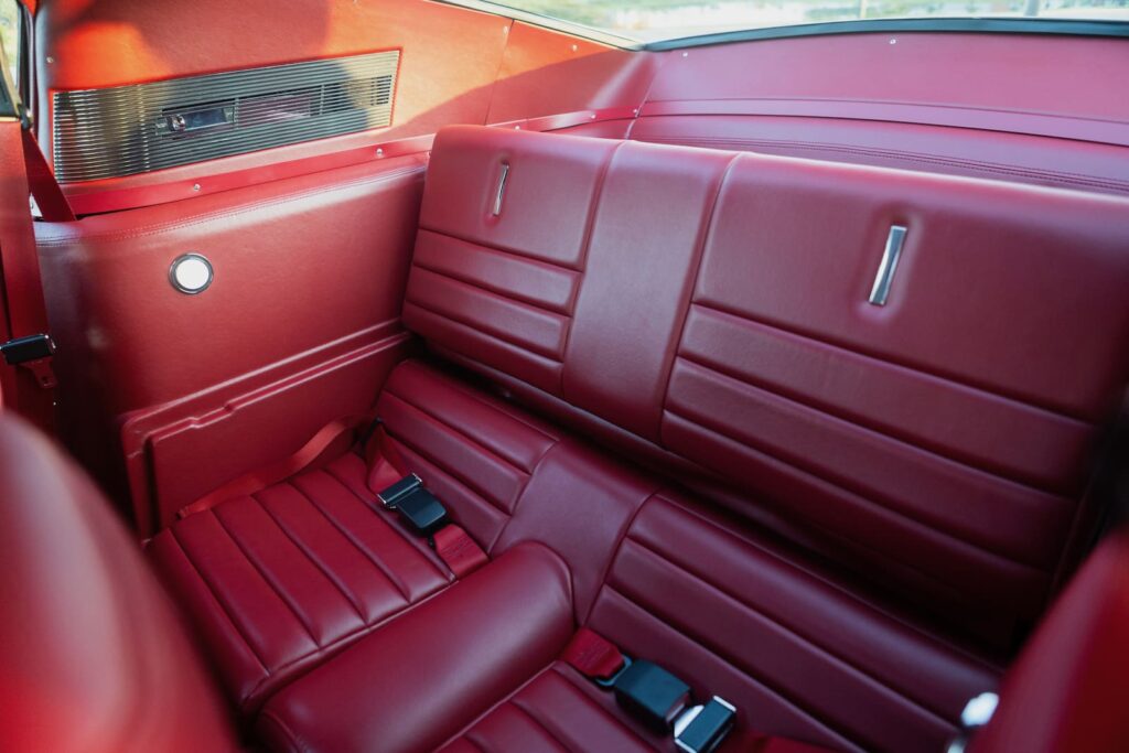 Backseat of a 1967 Mustang GT / GTA 2+2 Fastback with a brown interior.