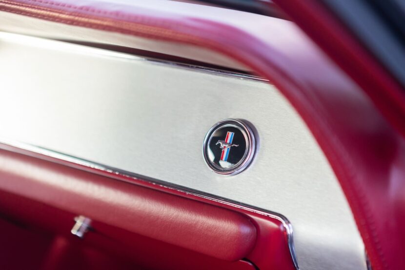 Closer look of a 1967 Mustang GT / GTA 2+2 Fastback glove compartment emblem.