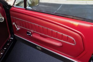 A close-up of a 1967 Mustang GT / GTA 2+2 Fastback passenger side door.