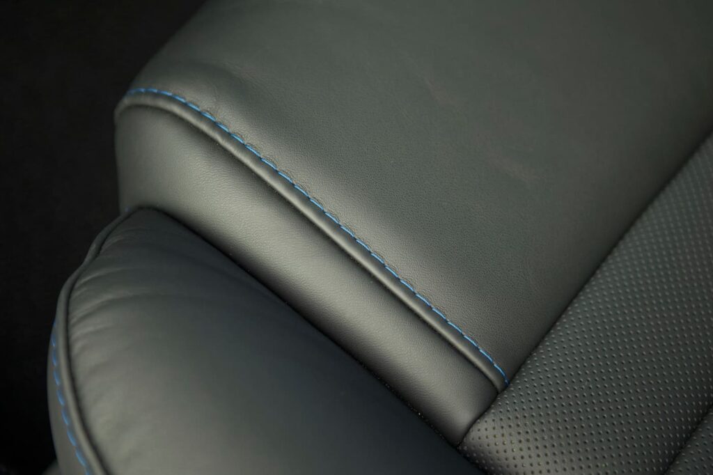 Grey leather fitted by hand with blue thread seats interior in a 1968 Mustang GT 2+2 Fastback Cobra Jet