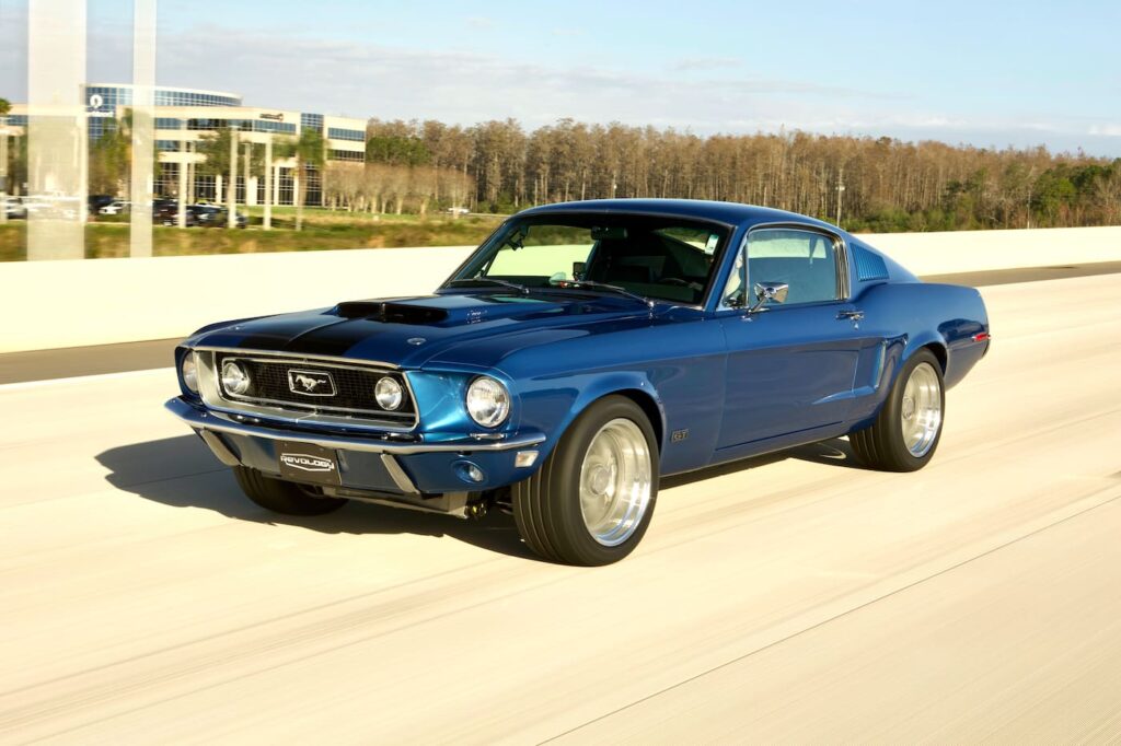 Left view of 1968 Mustang GT 2+2 Fastback Cobra Jet in motion on the road