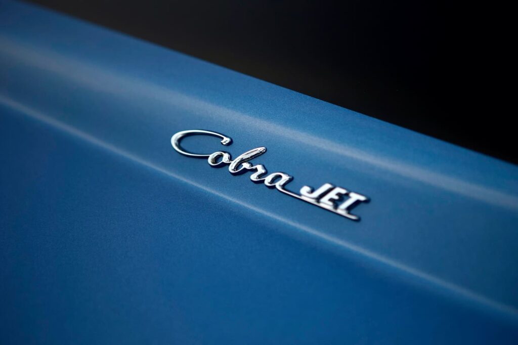 A close-up of a 1968 Mustang GT 2+2 Fastback Cobra Jet letter emblem