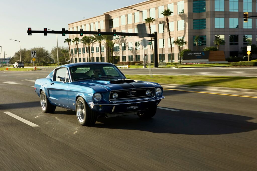 Right view of 1968 Mustang GT 2+2 Fastback Cobra Jet in motion on the road