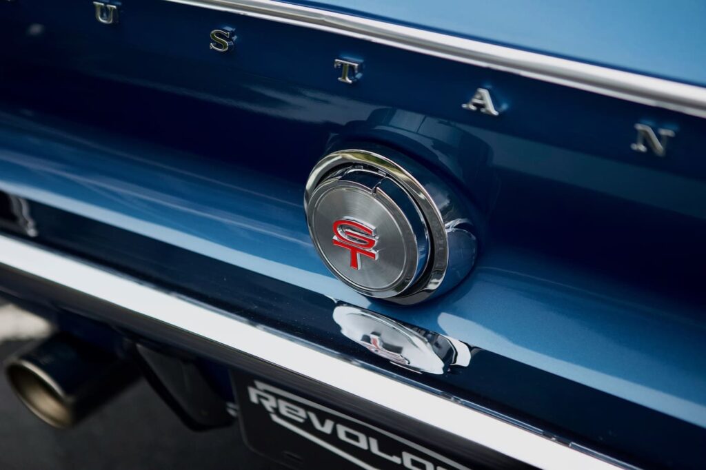 A close-up of a 1968 Mustang GT 2+2 Fastback Cobra Jet trunk emblem