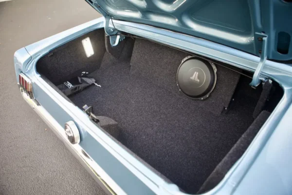 10” enclosed subwoofer in a truck of a 66 Mustang 2+2 Fastback