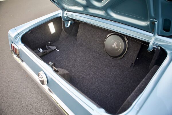 10” enclosed subwoofer in a truck of a 66 Mustang Convertible.