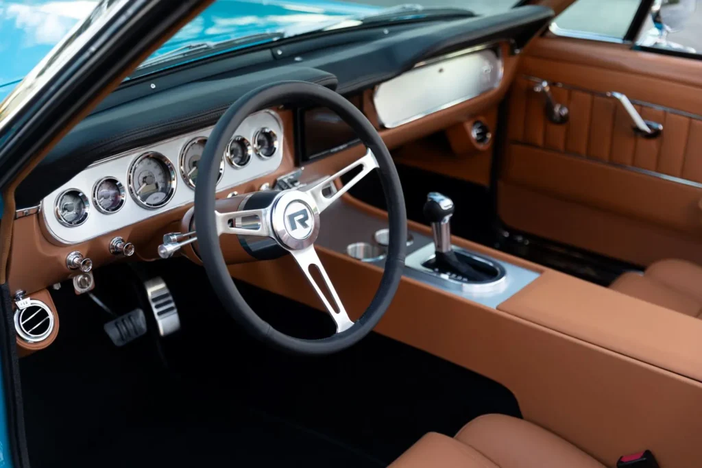 Brown interior of a 1966 Mustang Convertible with a left door open