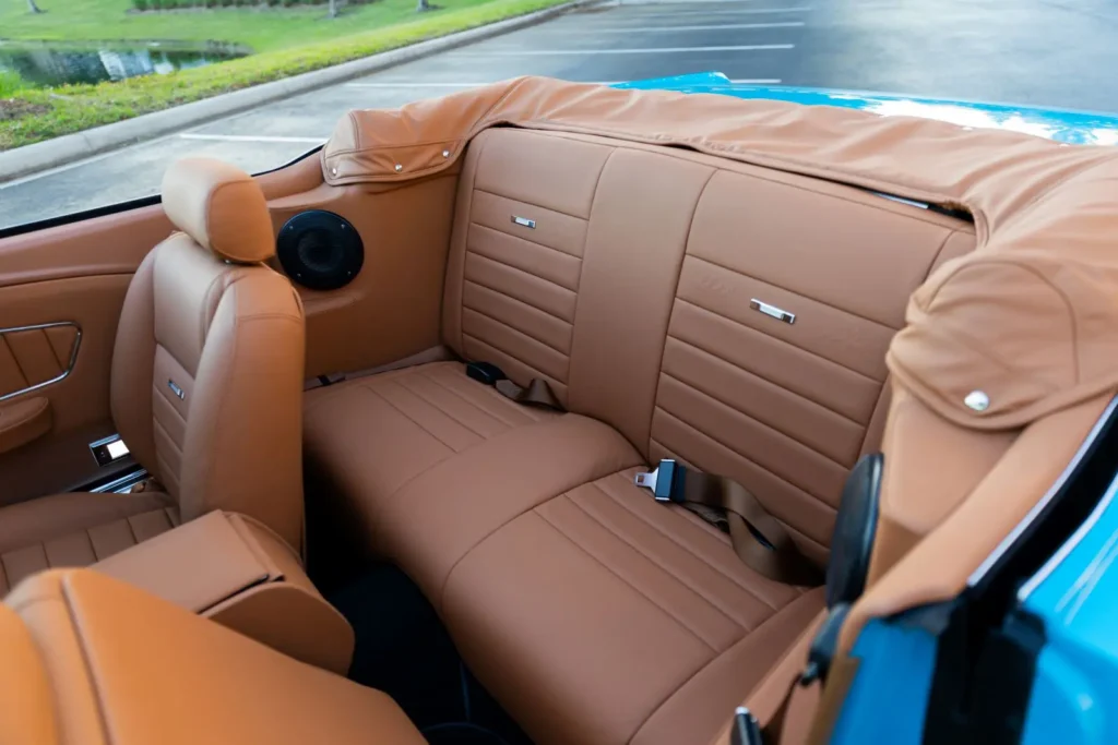 Closer look of a 1966 Mustang Convertible back seats brown leather interior.