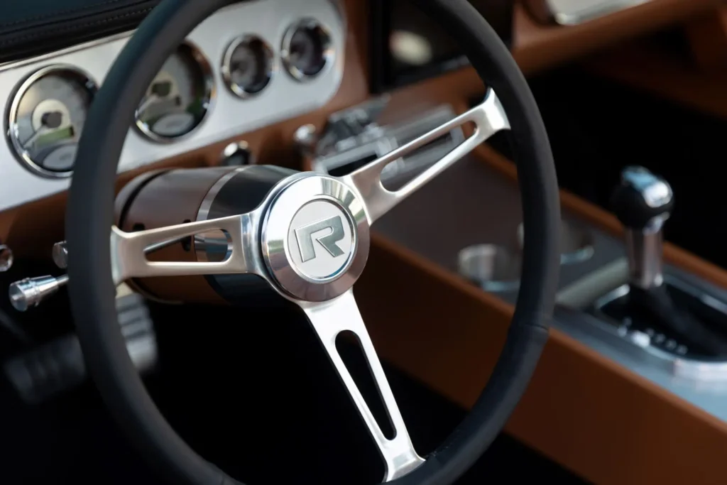 Interior of a 1966 Mustang Convertible shot from the steering wheel.