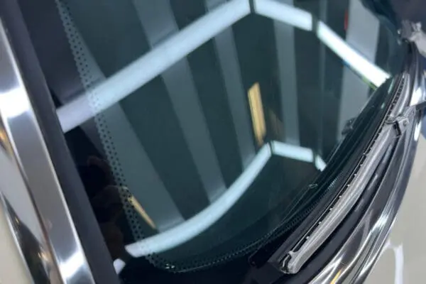 A polyurethane bonded windshield and backlite glass of a 1967 Shelby GT 350.