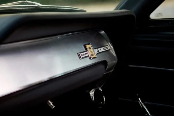 Glove department with emblem in a 1967 Shelby GT 500 interior.