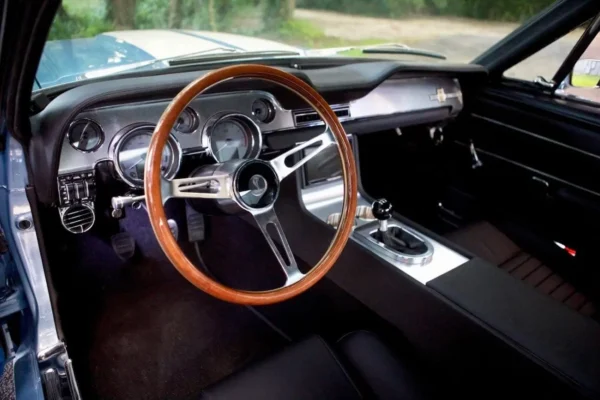 Wood design steering wheel in a 1967 Shelby GT 500 interior.