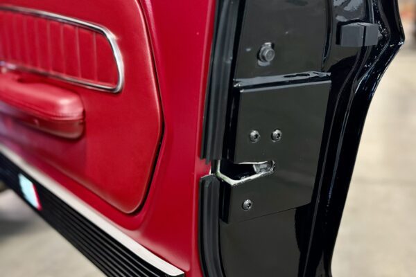 A close-up to the 1967 Mustang GT / GTA 2+2 Fastback door latch mechanisms.