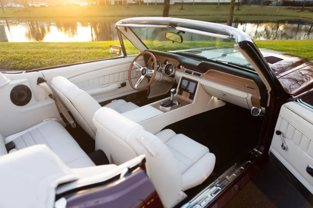 1968 Shelby GT500 KR Convertible with the right door open parked next to a pond