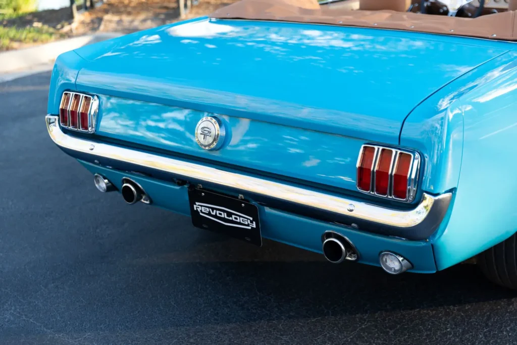 A close-up of a blue 1966 Mustang Convertible trunk