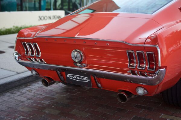 A closer look to the truck of a red 1967 Mustang GT / GTA 2+2 Fastback.